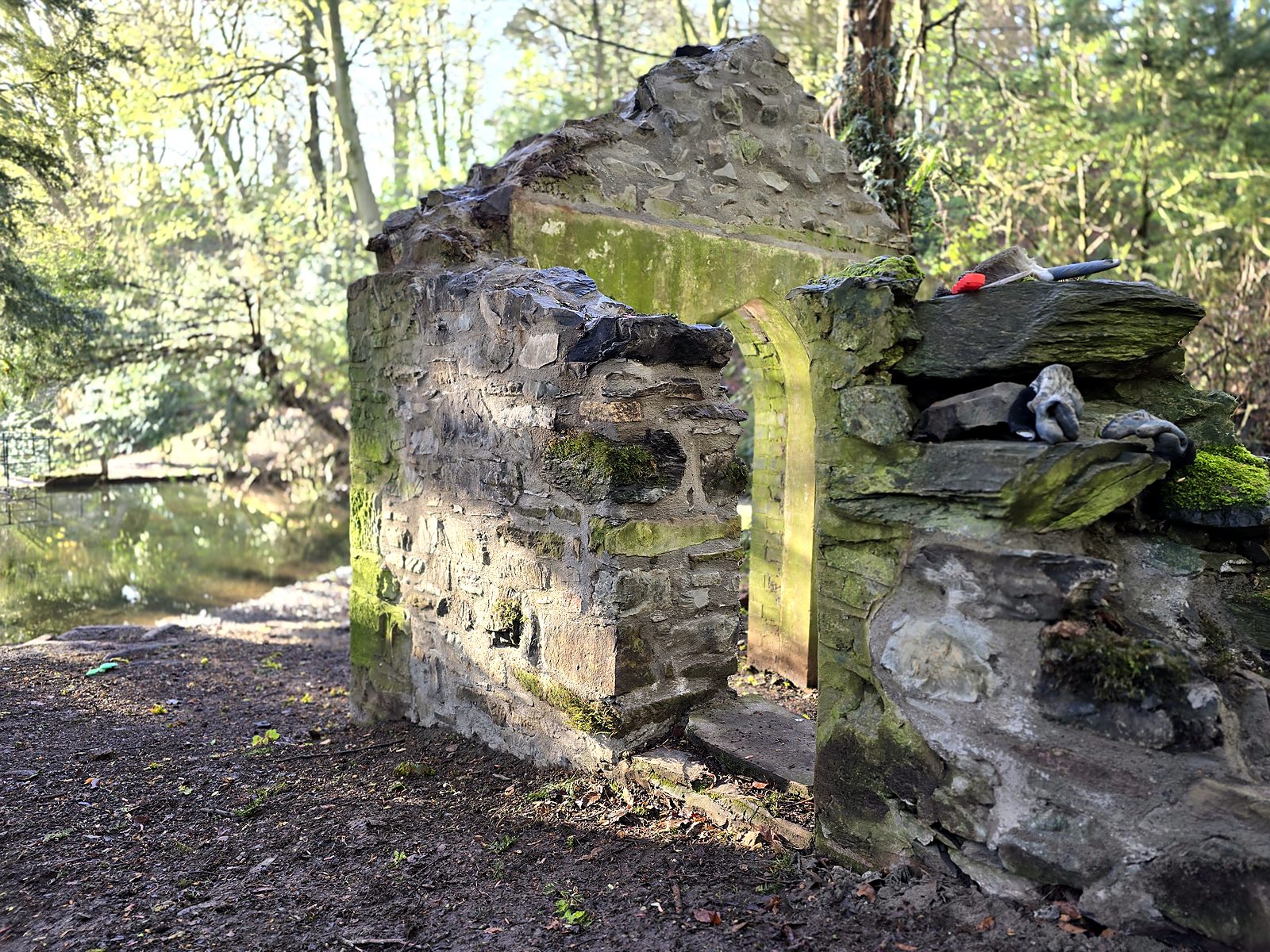 Rebuilt side wall beside the arched gable of the Pump House