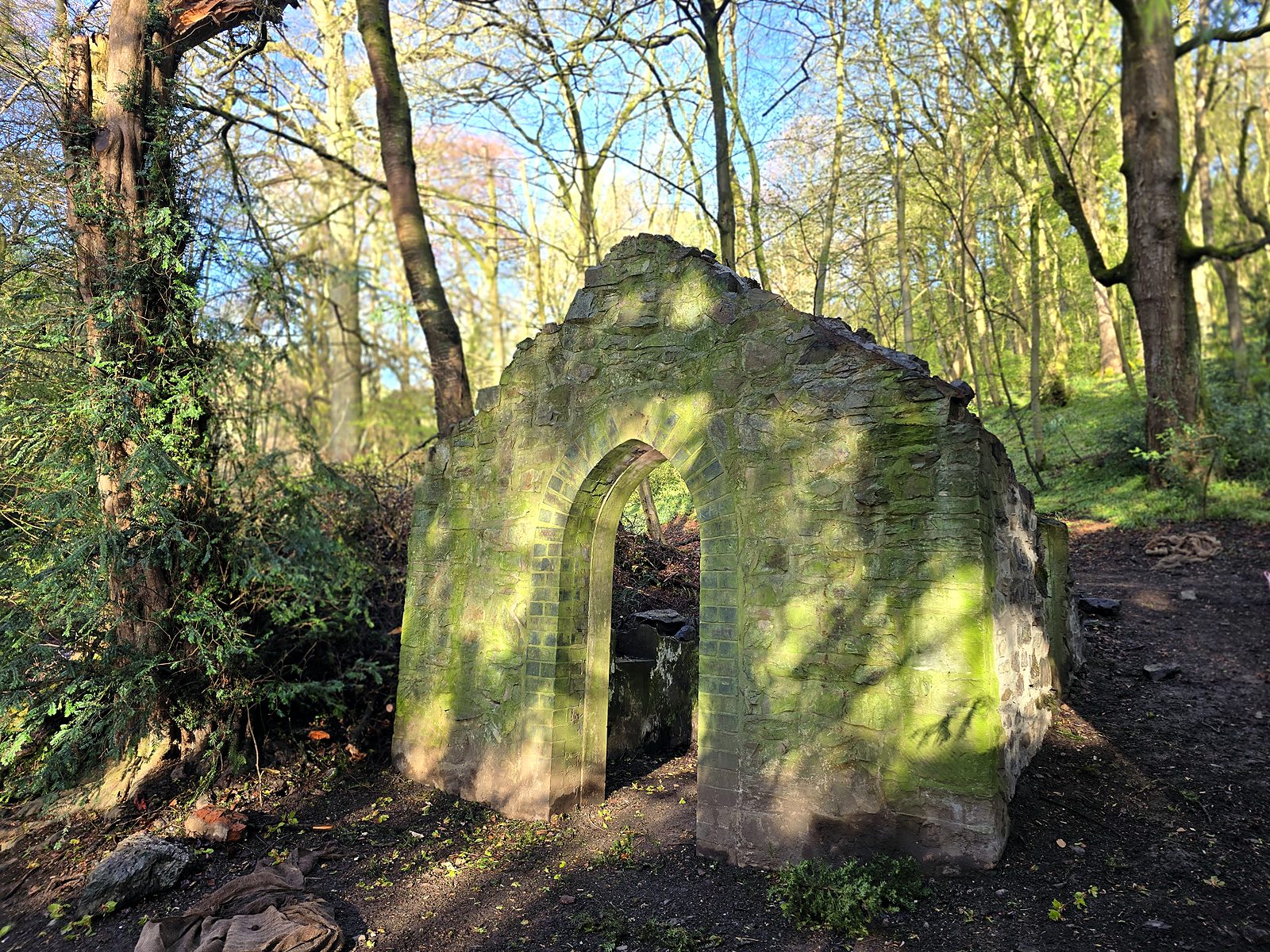The completed Pump House among the trees in Rectory Wood