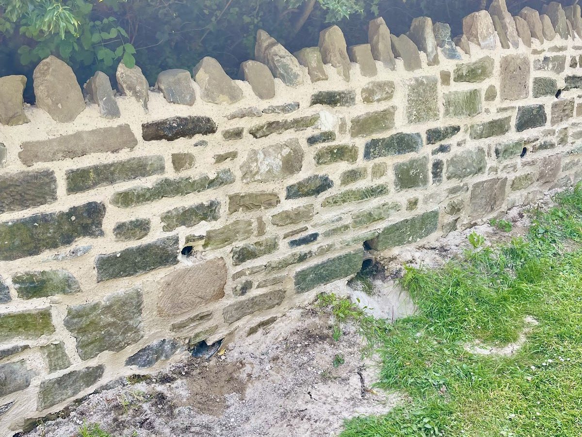 New drainage holes in the rebuilt wall