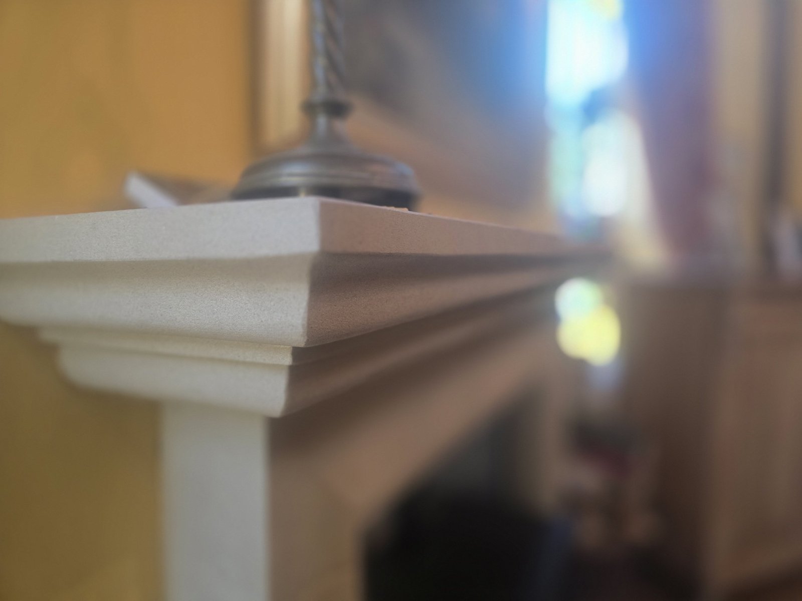 Close-up of a stone fireplace mantel shelf