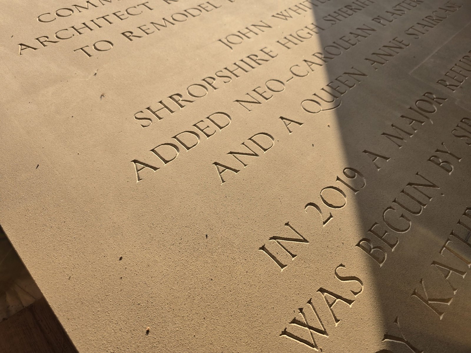 Close-up of a hand-cut inscription in stone